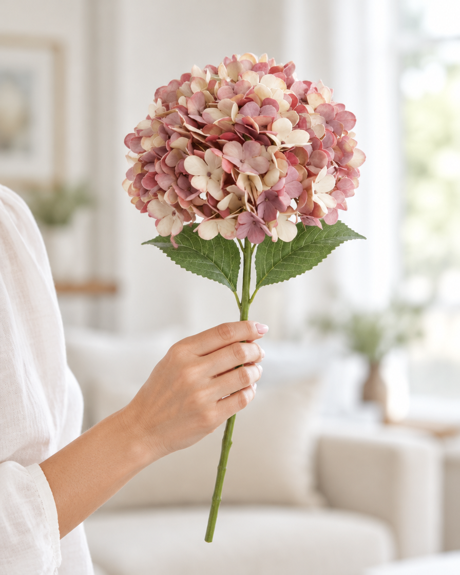 Dusty Pink Artificial Hydrangea Stem held in a hand