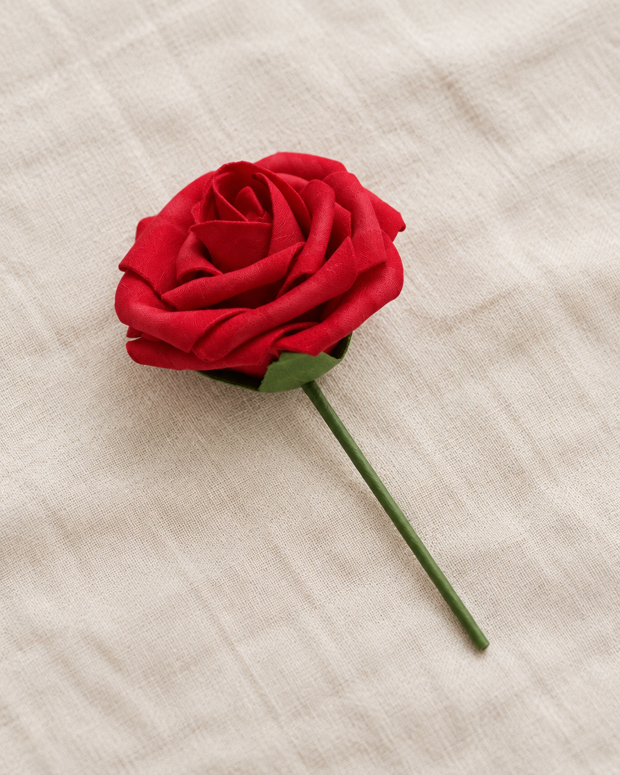 Red Artificial Rose Stem, shown alone on a linen background