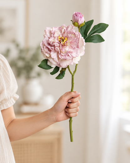 Dusty Lilac Artificial Peony Stem held in a hand
