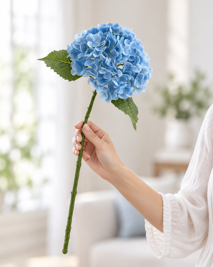 Blue Artificial Hydrangea Stem held in a hand