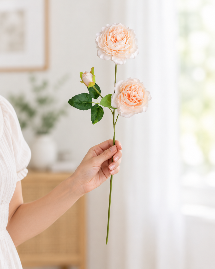 Peach Artificial Peony Stem held in a hand
