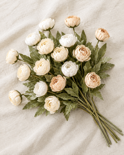 Cream and Apricot Artificial Ranunculus Stems, shown alone on a linen background