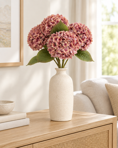 Dusty Rose Artificial Hydrangea Stems styled in a ceramic vase on a console table (vase sold separately)
