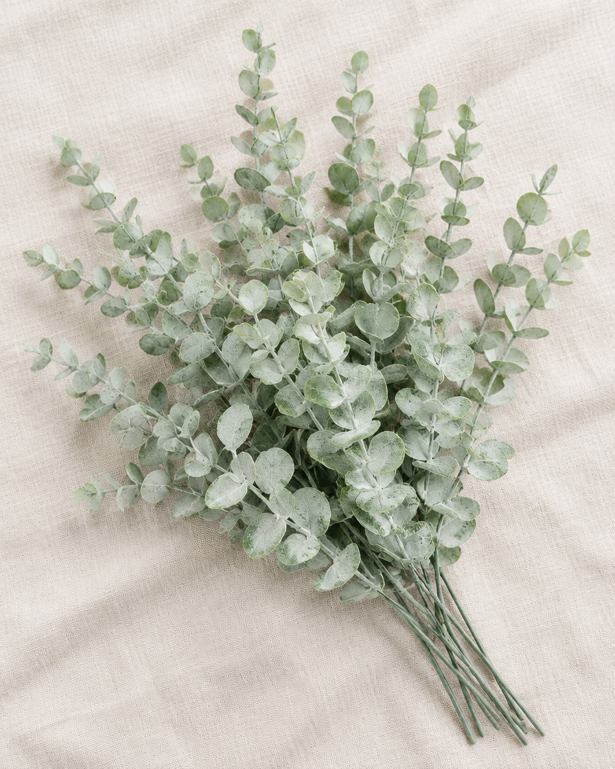 Frosted Sage Artificial Eucalyptus Stems, shown alone on a linen background