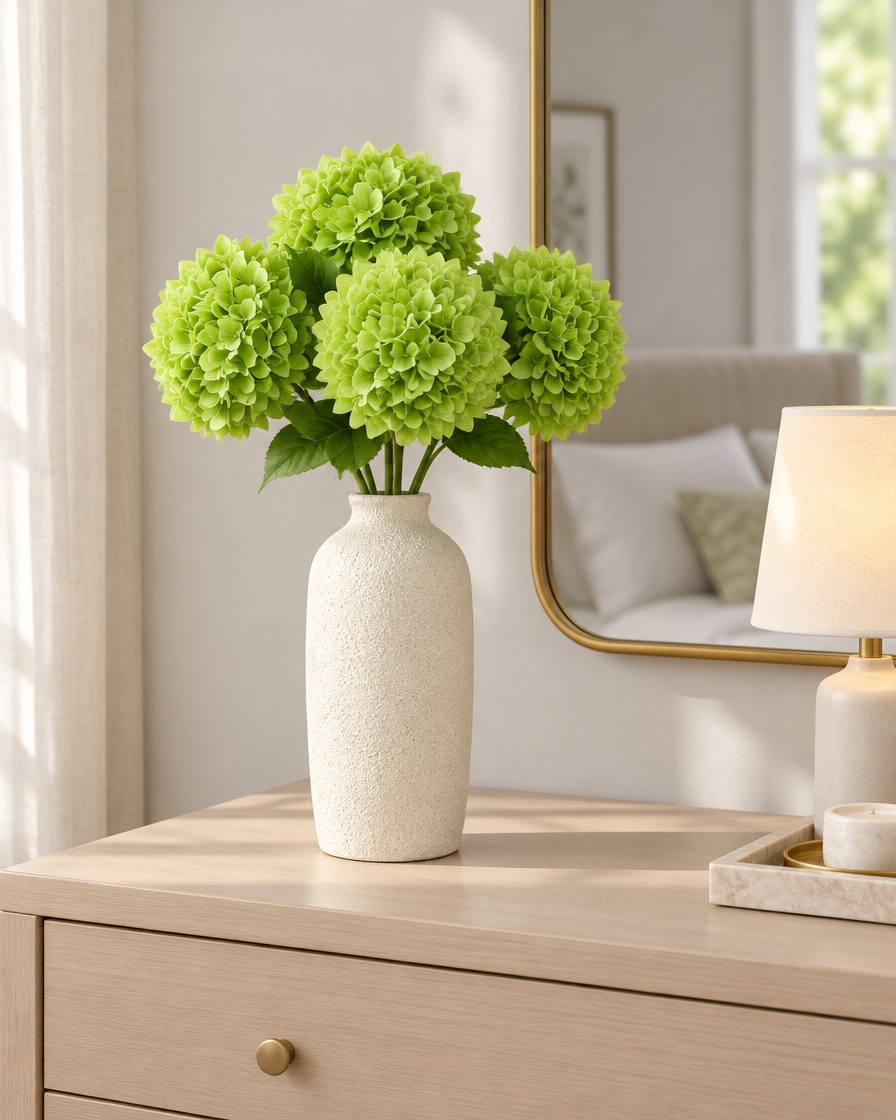 Apple Green Artificial Hydrangea Stems styled in a ceramic vase on a dresser (vase sold separately)