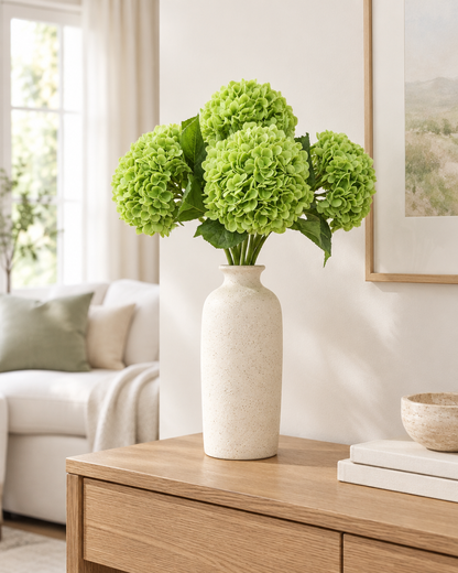 Apple Green Artificial Hydrangea Stems styled in a ceramic vase on a console table (vase sold separately)