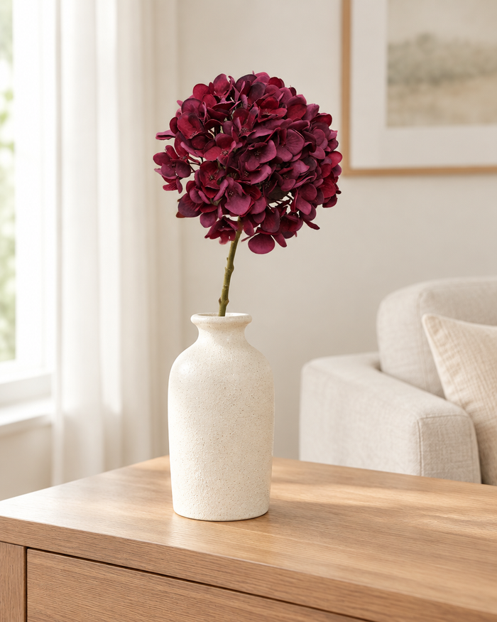 Burgundy Artificial Hydrangea Stem styled in a ceramic vase on a console table (vase sold separately)