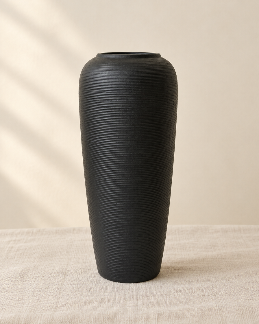 Matte Black Fine-Ridged Ceramic Vase, shown alone on a linen background
