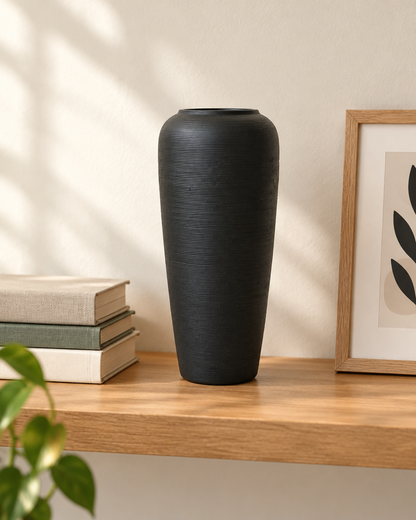 Matte Black Fine-Ridged Ceramic Vase on a wooden shelf