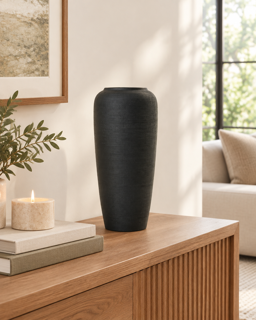 Matte Black Fine-Ridged Ceramic Vase on a console table