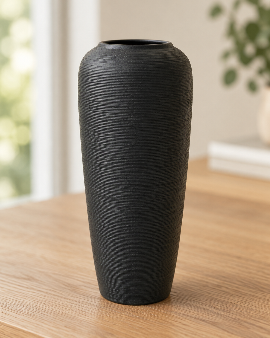 Close-up of the finish of the matte black fine-ridged ceramic vase