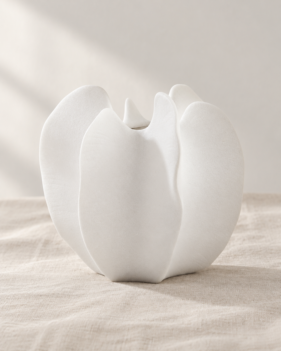 White Lobed Sculptural Ceramic Vase, shown alone on a linen background