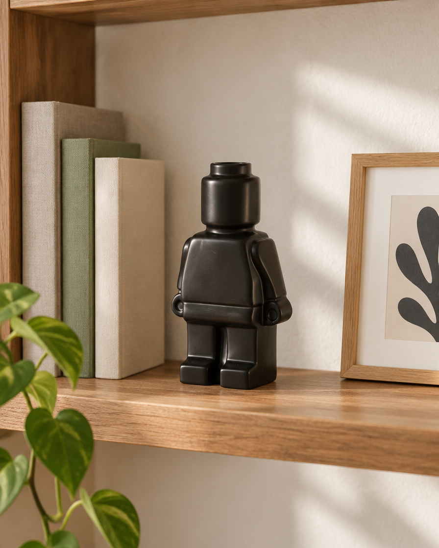 Matte Black Blocky Figure Ceramic Vase on a wooden shelf