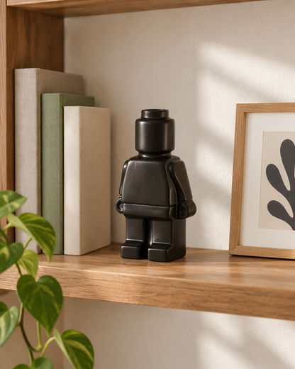 Matte Black Blocky Figure Ceramic Vase on a wooden shelf