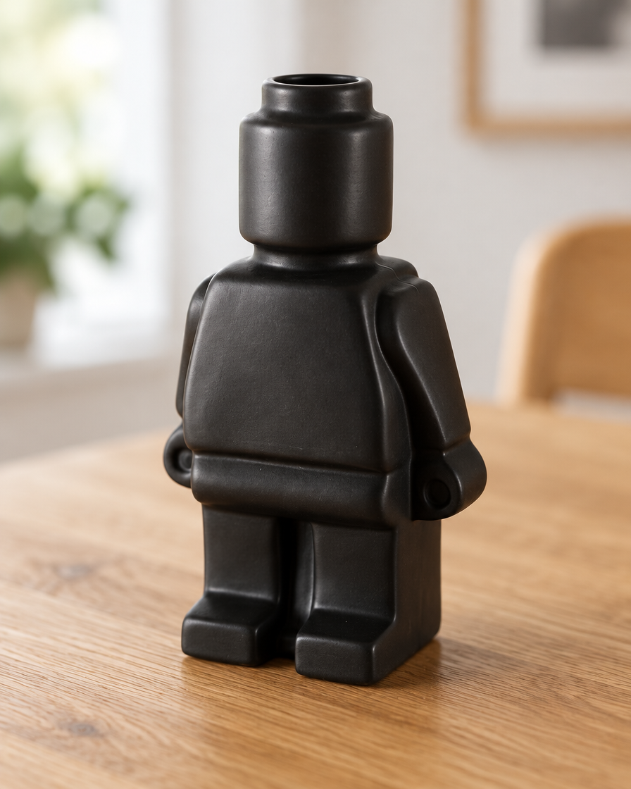 Close-up of the finish of the matte black blocky figure ceramic vase