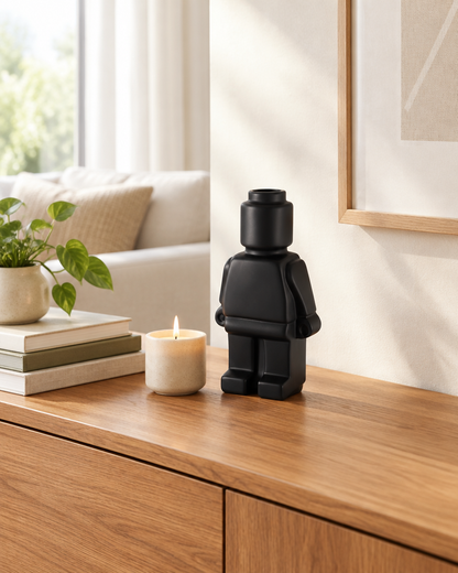 Matte Black Blocky Figure Ceramic Vase on a console table