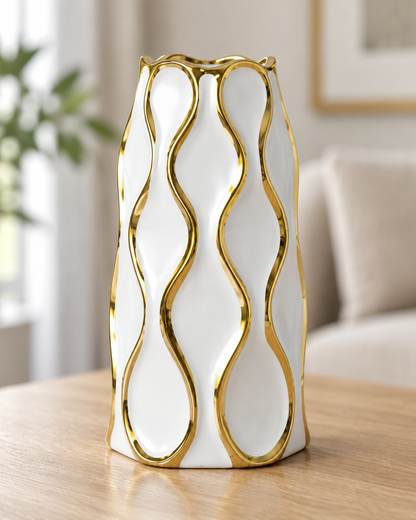 Close-up of the finish of the white ceramic vase with gold wavy lines