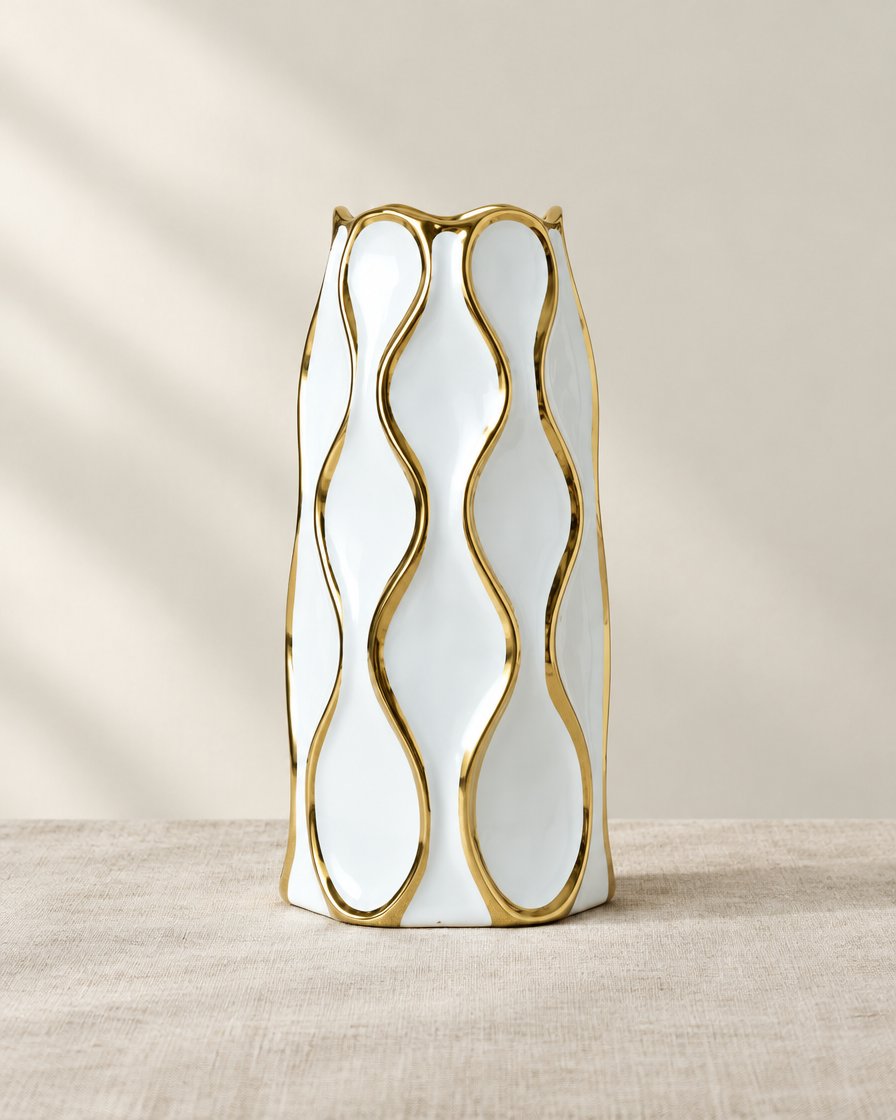 White Ceramic Vase with Gold Wavy Lines, shown alone on a linen background