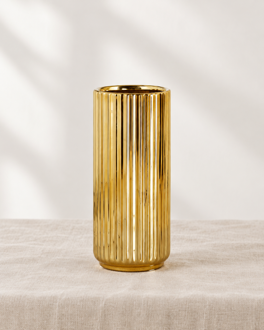 Gold Ribbed Cylinder Ceramic Vase, shown alone on a linen background