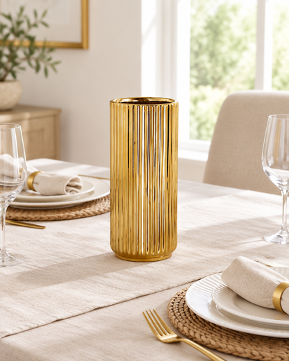 Gold Ribbed Cylinder Ceramic Vase on a dining table