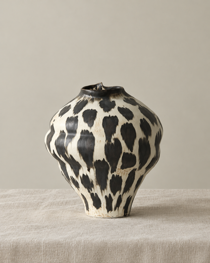 Wabi-Sabi Black and White Porcelain Vase, shown alone on a linen background