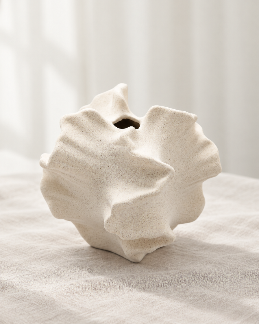 Cream Ruffled Coral Ceramic Vase, shown alone on a linen background