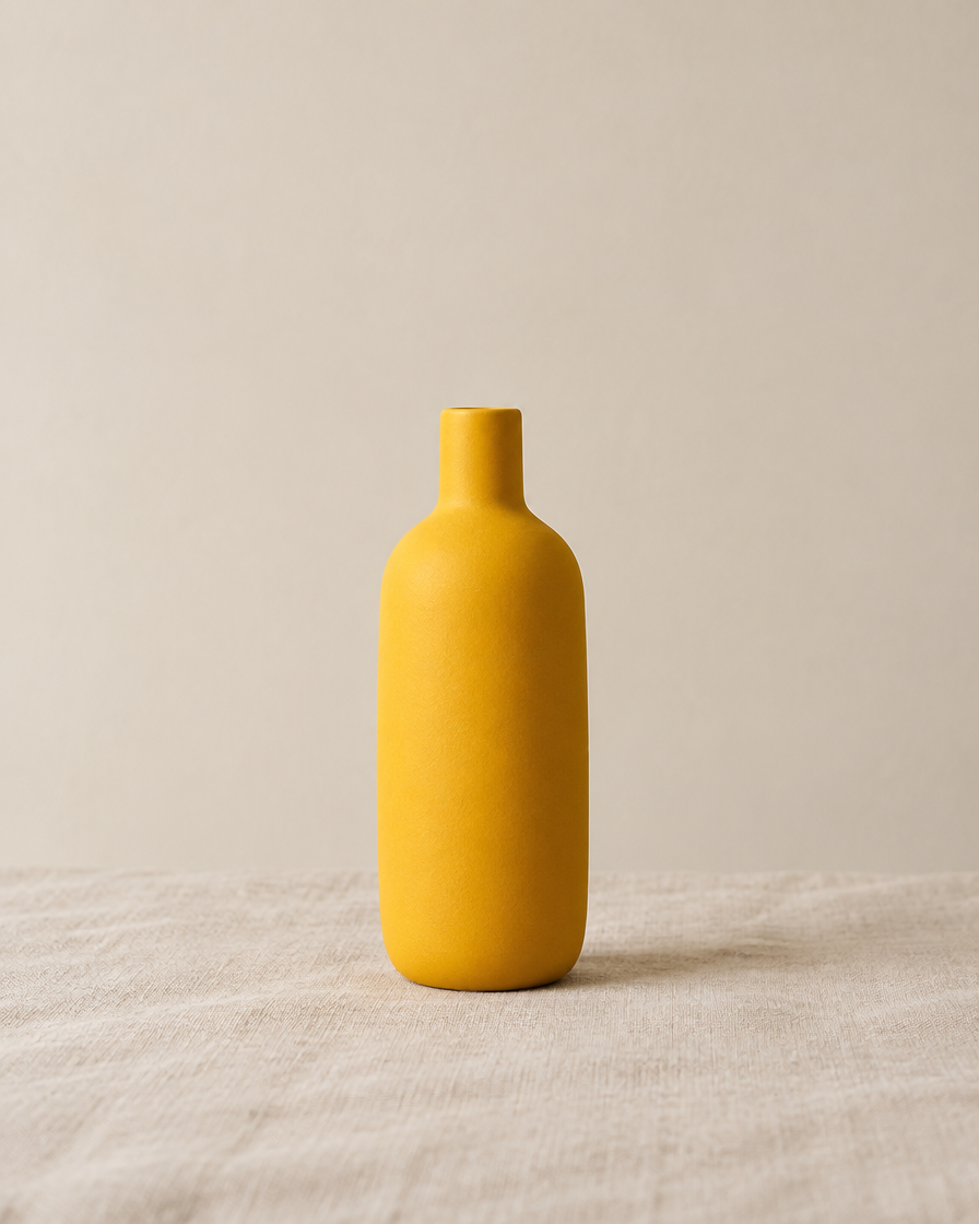 Mustard Yellow Matte Bottle Vase, shown alone on a linen background