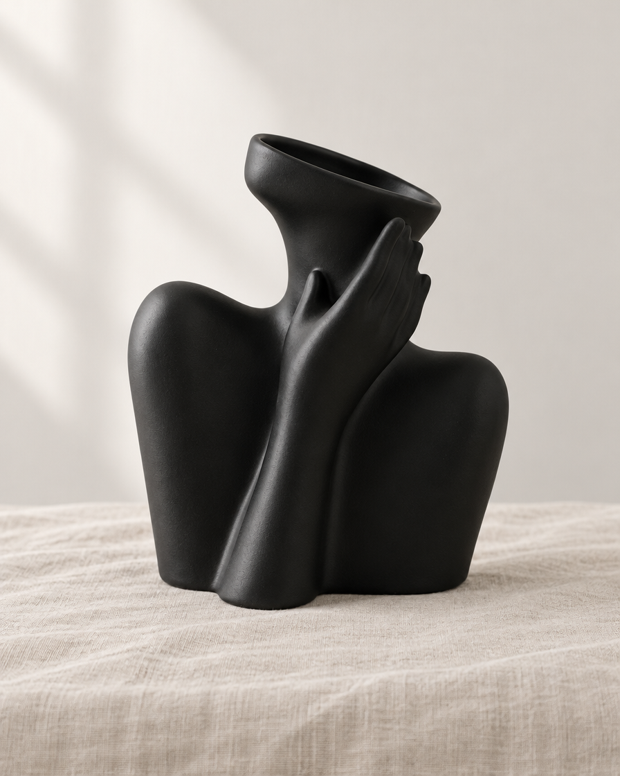 Matte Black Abstract Body Sculpture Ceramic Vase, shown alone on a linen background