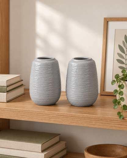 Set of 2 Grey Embossed Ceramic Vases on a wooden shelf