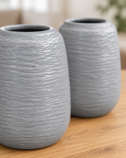 Close-up of the finish of the set of 2 grey embossed ceramic vases