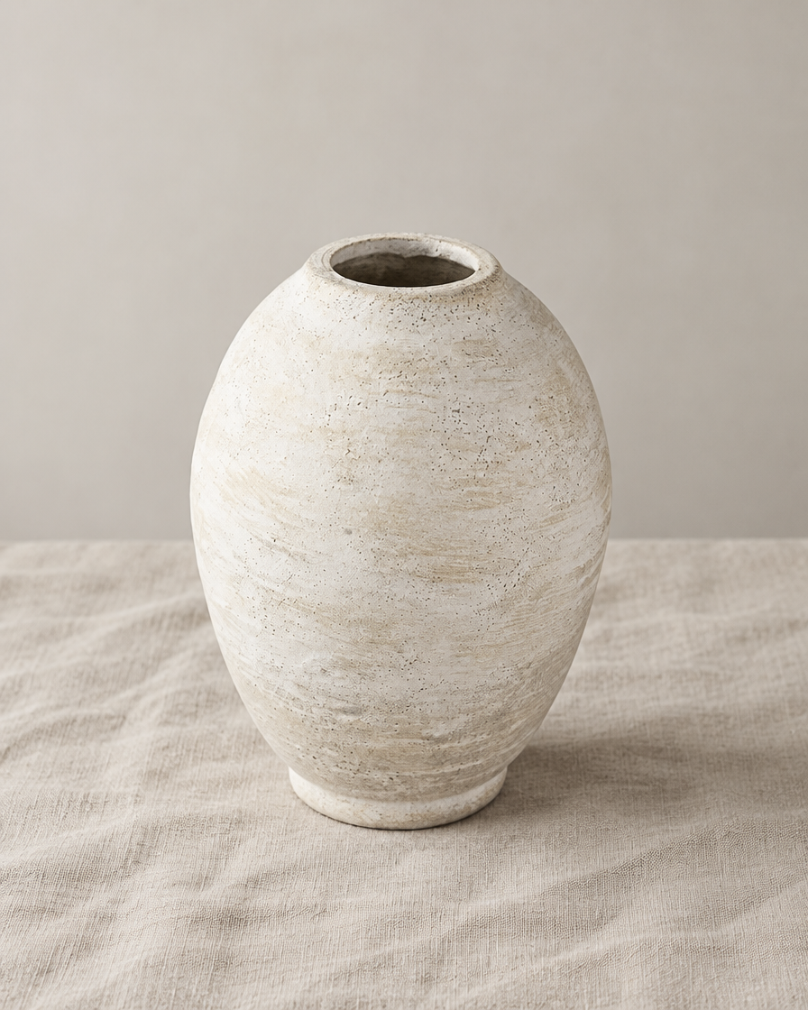 Weathered Ivory Oval Ceramic Vase, shown alone on a linen background
