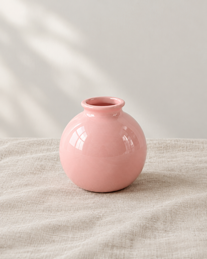 Pink Glossy Mini Round Vase, shown alone on a linen background