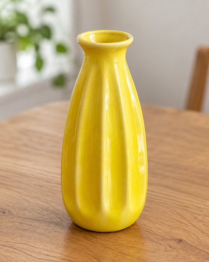 Close-up of the finish of the yellow ribbed ceramic bud vase