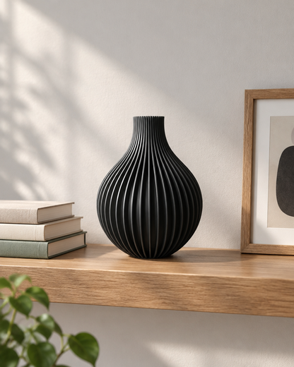Black Ribbed Teardrop Vase on a wooden shelf