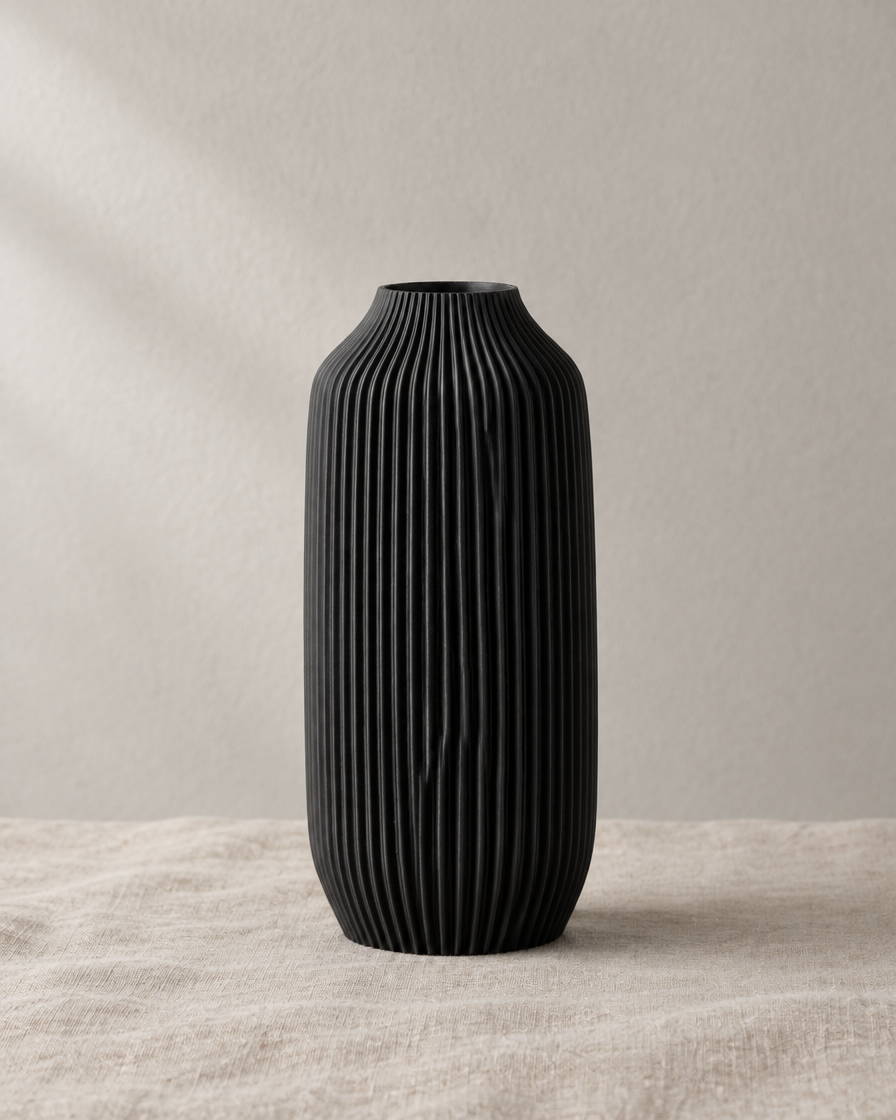 Black Ribbed Matte Cylinder Vase, shown alone on a linen background