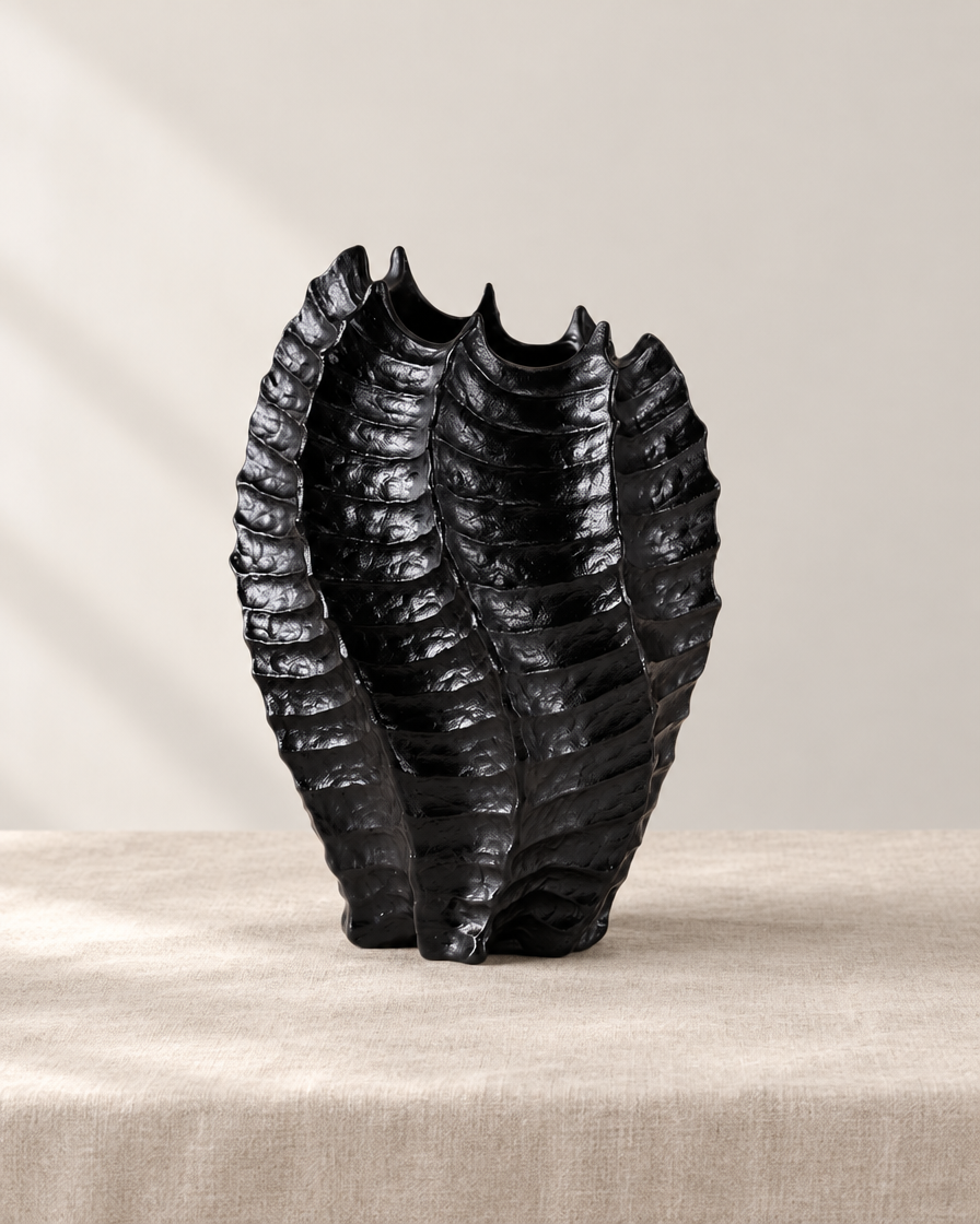 Black Glossy Ribbed Coral-Shaped Vase, shown alone on a linen background