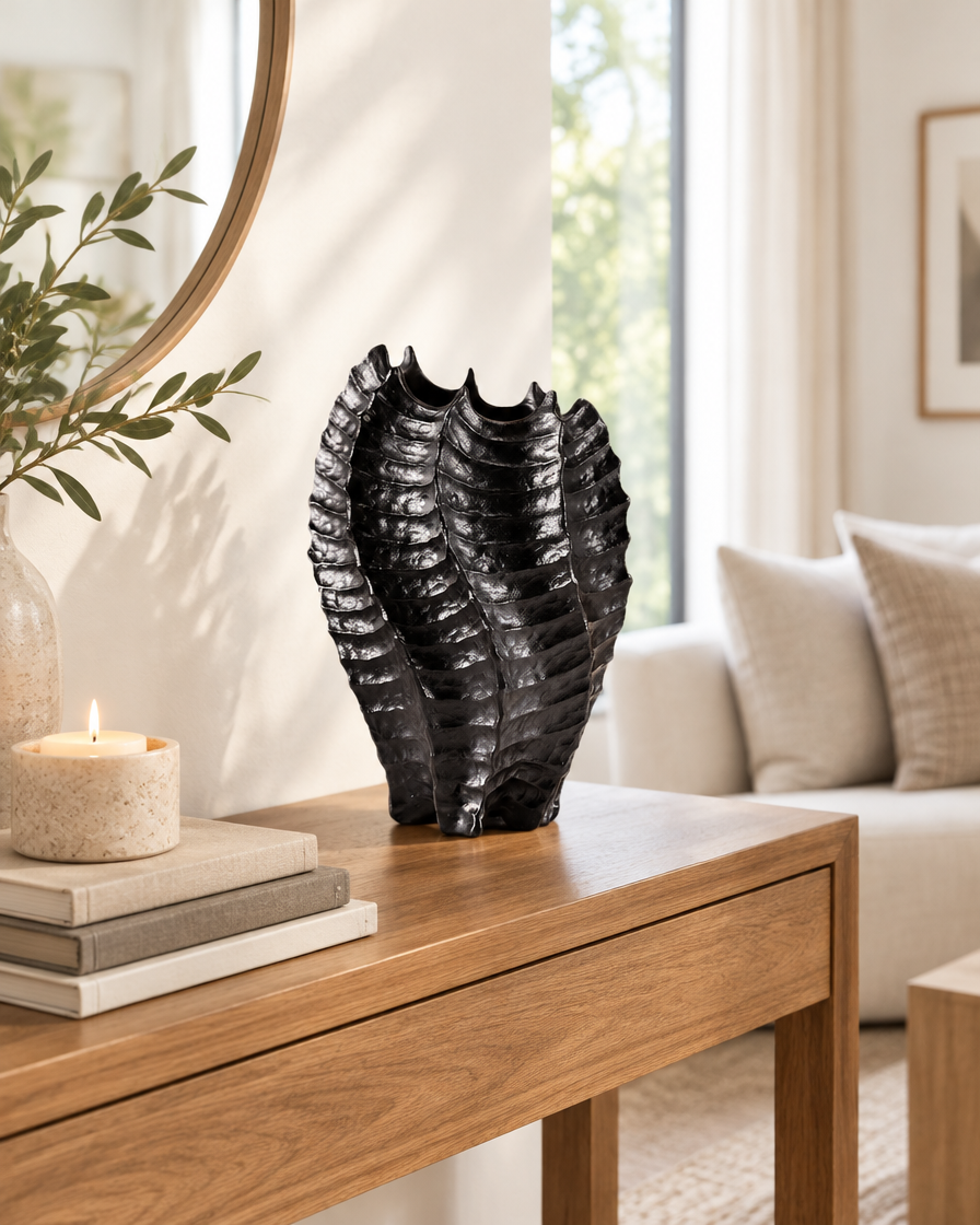 Black Glossy Ribbed Coral-Shaped Vase on a console table