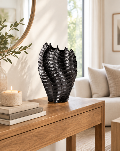 Black Glossy Ribbed Coral-Shaped Vase on a console table