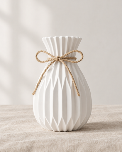 White Pleated Vase with Jute Bow, shown alone on a linen background