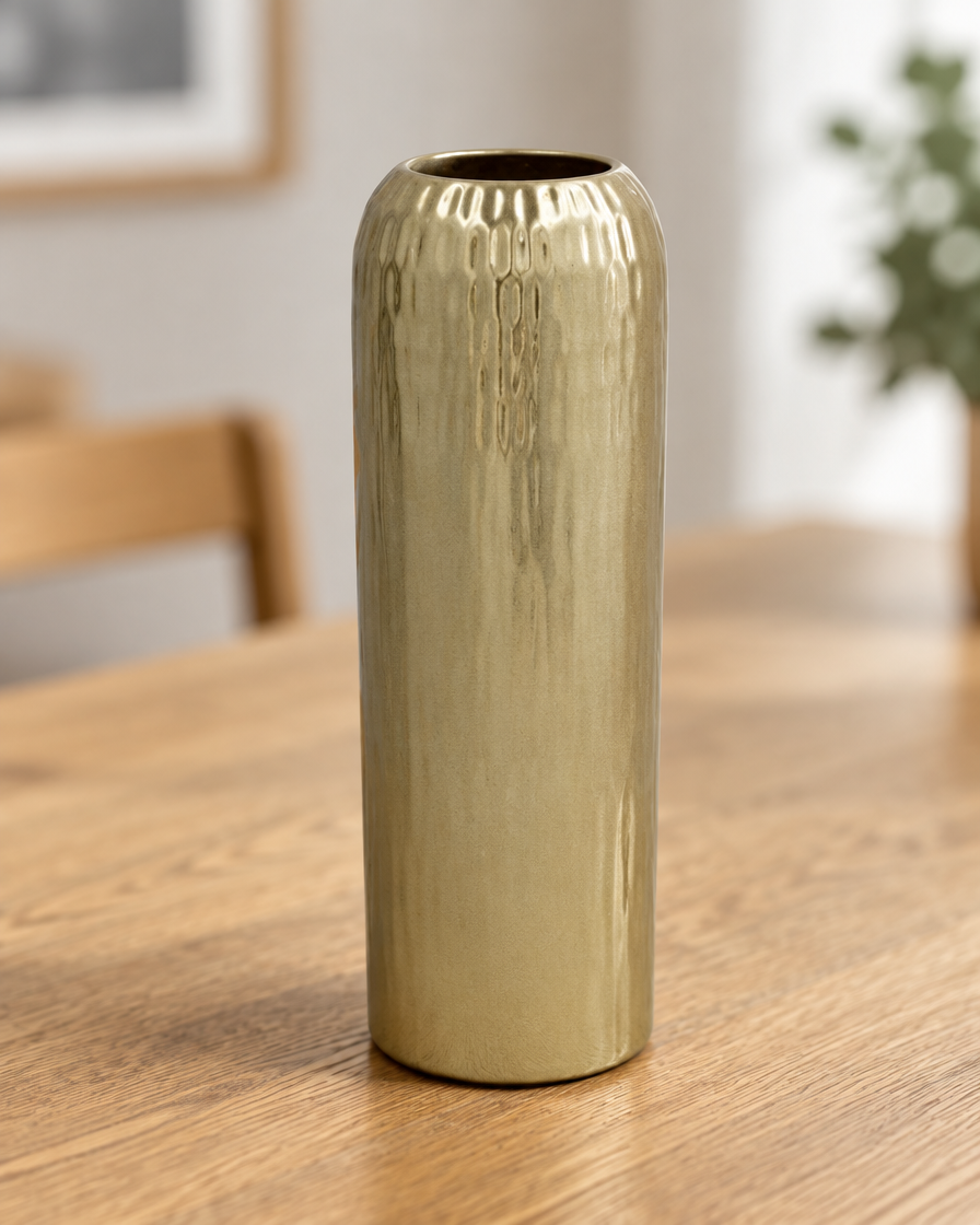 Close-up of the finish of the champagne gold textured cylinder vase