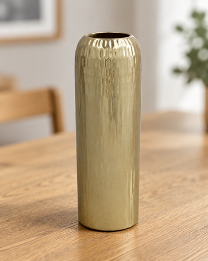 Close-up of the finish of the champagne gold textured cylinder vase