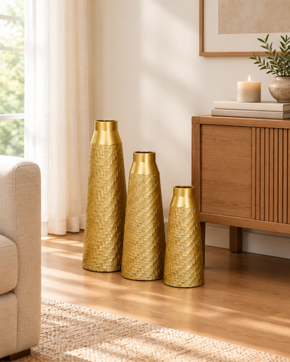 Set of 3 Gold Woven-Texture Tapered Floor Vases beside a console table