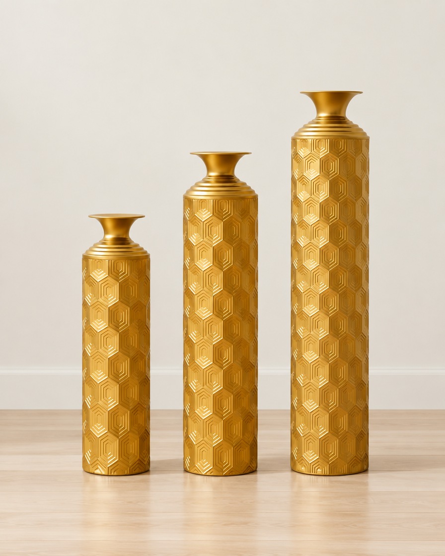 Set of 3 Gold Honeycomb-Texture Metal Floor Vases, shown alone against a plain wall