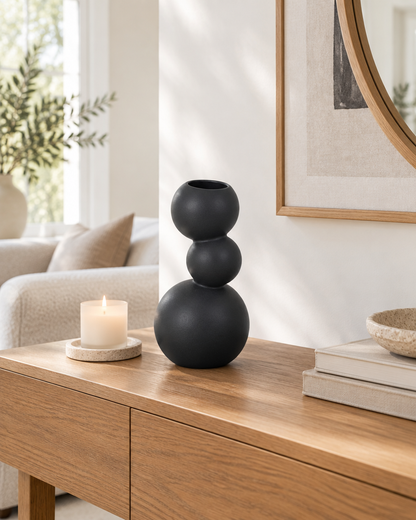 Black Stacked Ball Ceramic Vase on a console table