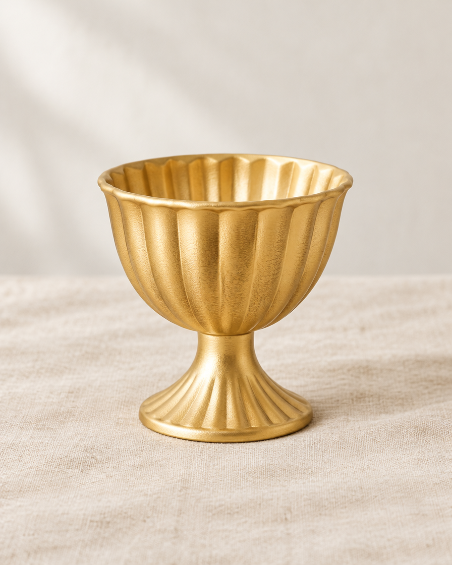 Gold Fluted Pedestal Urn Vase, shown alone on a linen background