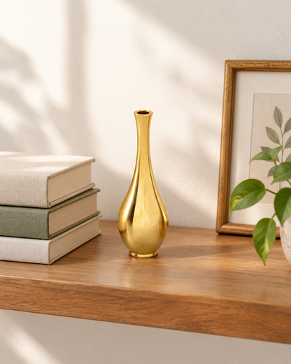 Mini Brushed Gold Metal Bud Vase on a wooden shelf