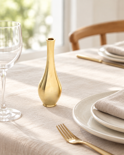 Mini Brushed Gold Metal Bud Vase on a dining table
