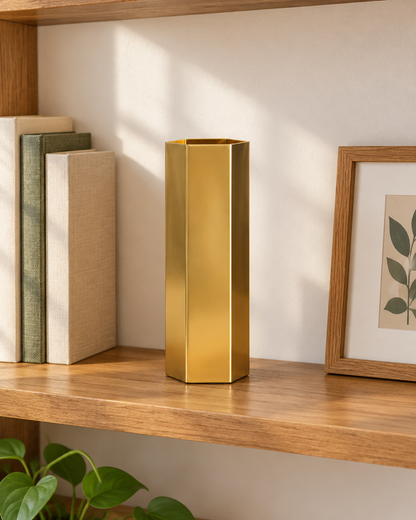 Brass-Tone Hexagonal Metal Vase on a wooden shelf