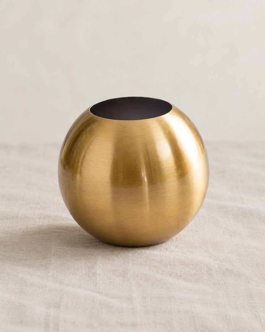 Brushed Gold Metal Sphere Vase, shown alone on a linen background