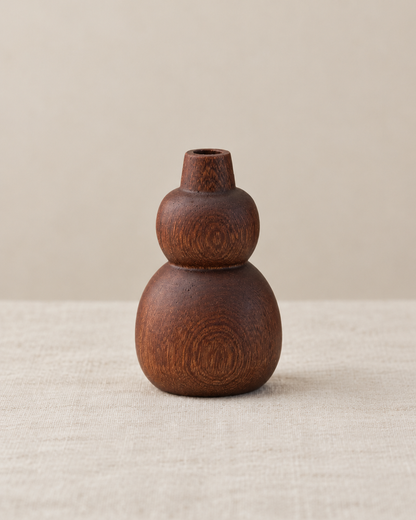 Mini Dark Wood Gourd Bud Vase, shown alone on a linen background
